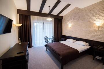 Фото номера Апартаменты с балконом Отель Piatra Pinului Ski &amp; Spa г. Гура-Гуморулуй 4